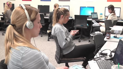 Students practicing in an audio lab